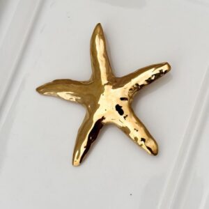 Broche Estrella de Mar Gold.