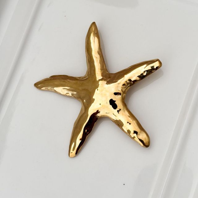 Broche Estrella de Mar Gold.